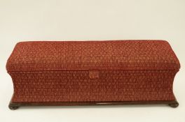 Early 20th century rosewood Ottoman on four bun feet, upholstered in red velvet