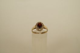 A 9ct gold cluster ring, set with synthetic stones, finger size P, 2 grams gross