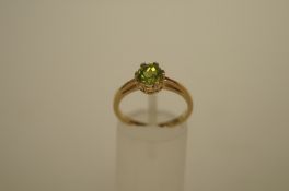 A peridot single stone 9ct gold ring, finger size N, 2.3g gross