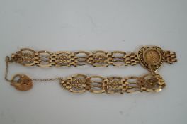 A gate bracelet with a heart locket 9ct gold
