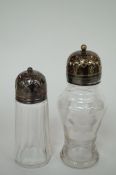 A silver top sugar shaker and one other