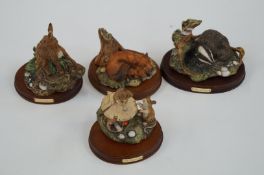 Four Royal Doulton wildlife figures including fox & cub, the badger, the woodmice and the hare