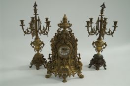 A brass clock garniture
