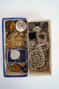 A box of paste jewellery and a collection of costume jewellery