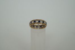 A 9ct gold diamond and sapphire full eternity ring