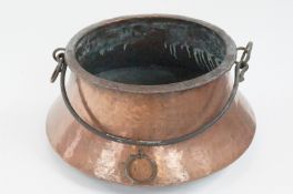 An Arts and Crafts beaten-copper cauldron