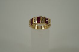 A ladies 14ct gold ring with diamonds and rubies (heavy)