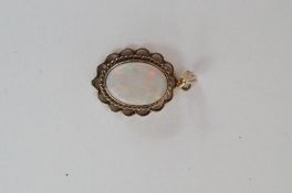 A 9ct gold large opal pendant