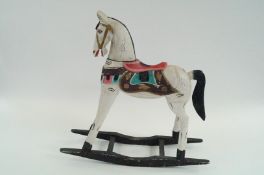 A decorative wooden rocking horse