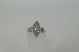 An 18ct gold old cut diamond boat shape cluster ring