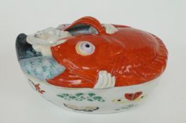 A Japanese oval shaped bowl with large carp held by a gentleman