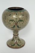 A bulbous vase decorated with art nouveau flowers