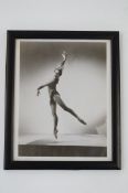 A framed photograph of a ballerina