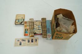 A large collection of various cigarette and tea cards