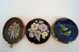 A Stratton compact, a Mascot compact and a miniature floral painting