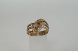 An 9ct gold snake ring