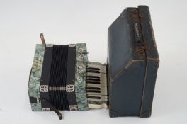 A Stelden German piano accordion in a hard case E 2871