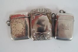 Two silver vesta cases and a silver plated example