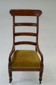 A cherry wood ladder back chair