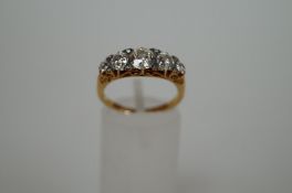 A five stone diamond ring marked "18"