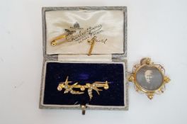 An Edwardian sea pearl brooch, a 9 ct gold brooch and one other