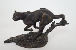 A metal figure of a cat