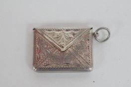 A silver stamp holder
