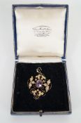 A large amethyst and pearl art nouveau pendant