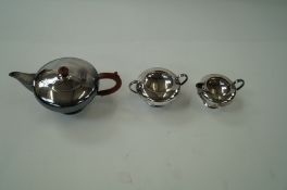 A silver plated teapot, milk jug and sugar