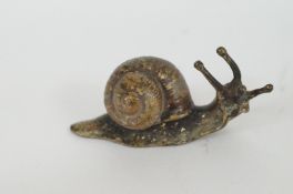 A bronze figure of a snail