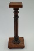 A carved mahogany stand