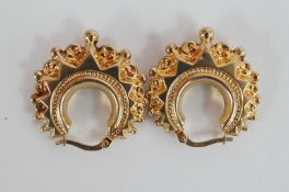 A pair of gold Creole earrings