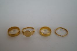 Three 22ct gold rings and one 18ct gold Ring