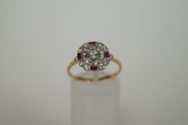 A tested 18ct gold diamond and ruby cluster ring