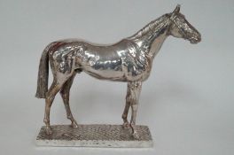 A large modern silver model of a horse, approx 2.6kg (weighted)