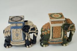 A pair of large ceramic decorative elephants