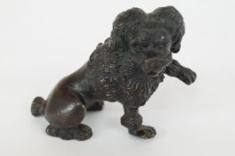 A bronze figure of a French poodle