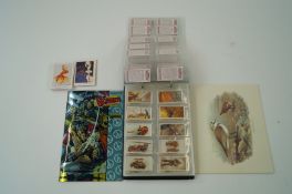 A large collection of stamps, postcards, various cigarette cards and other items