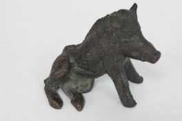 A bronzed figure of a boar