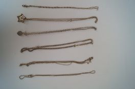 Seven assorted silver chains and pendants