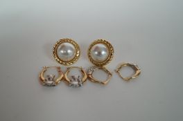 Two pairs of lever back hoop earrings and a pair of pearl earrings