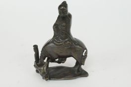 A bronze figure of a water buffalo