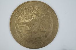 An oriental round bronze tray