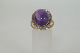An 18ct gold, diamond and cabochon amethyst ring