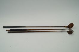 Three vintage golf clubs including a Gibbons Star and two other golf clubs