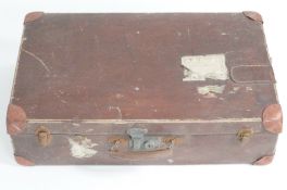 A composition suitcase 1930's with labels from Calais and Germany