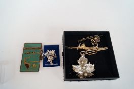 Four sterling silver charms and collection of costume brooches