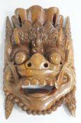 A large decorative South East Asian hardwood mask