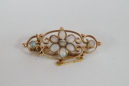 A stunning 15ct opal and diamond brooch