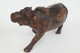 A wooden oriental carving of water buffalo, signed